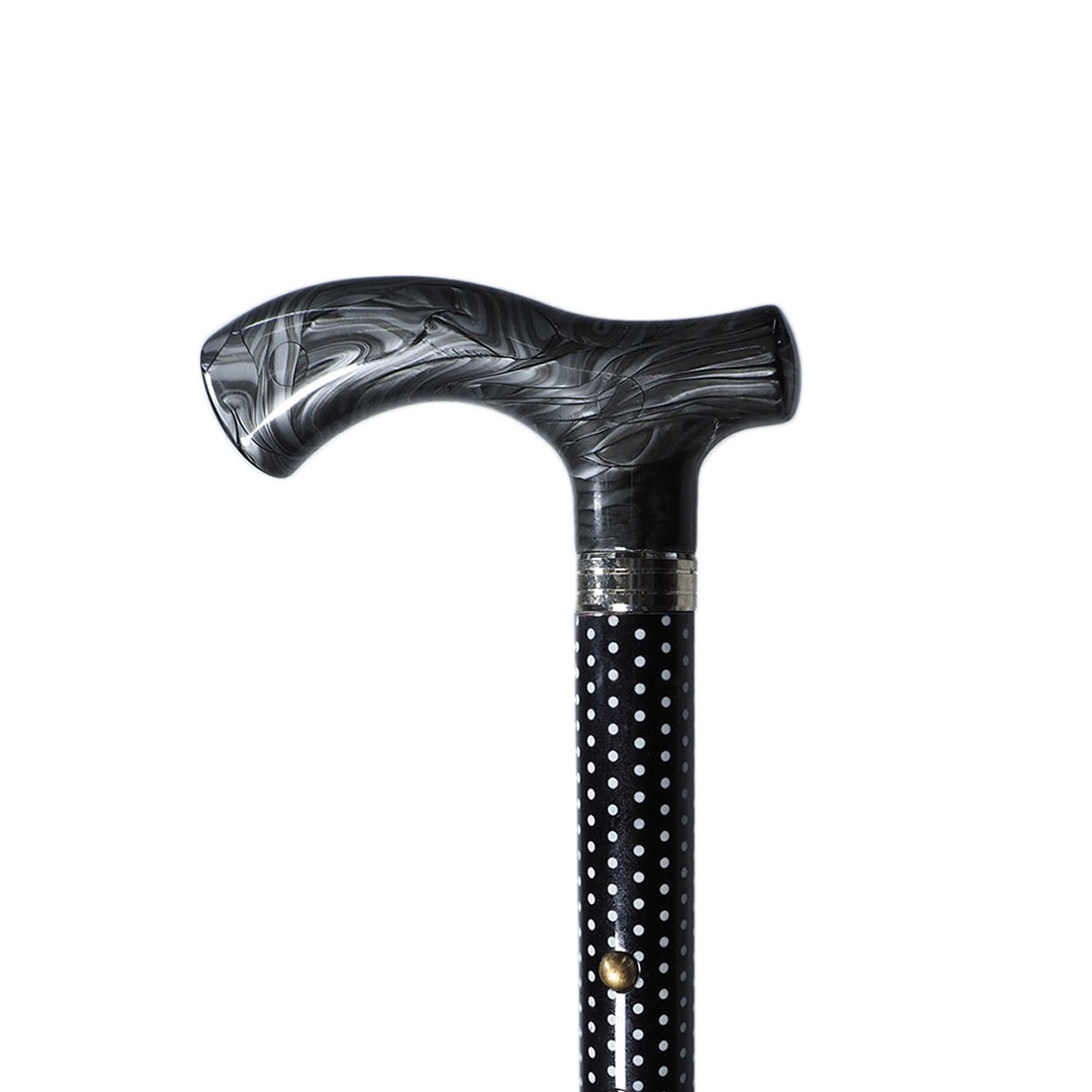 Folding cane 4 sections. White dotted stick.